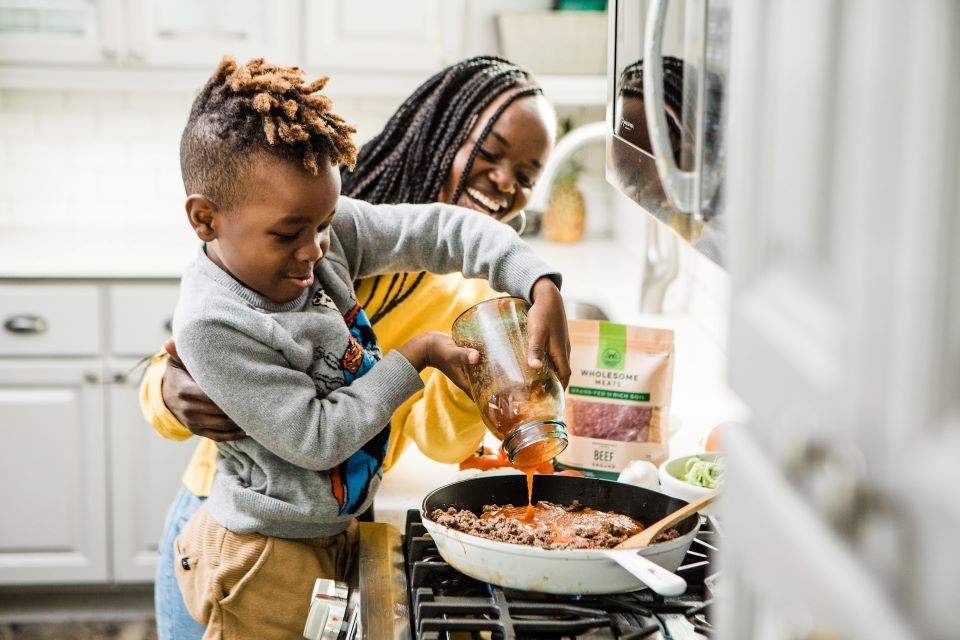 Boy cooking in kitchen